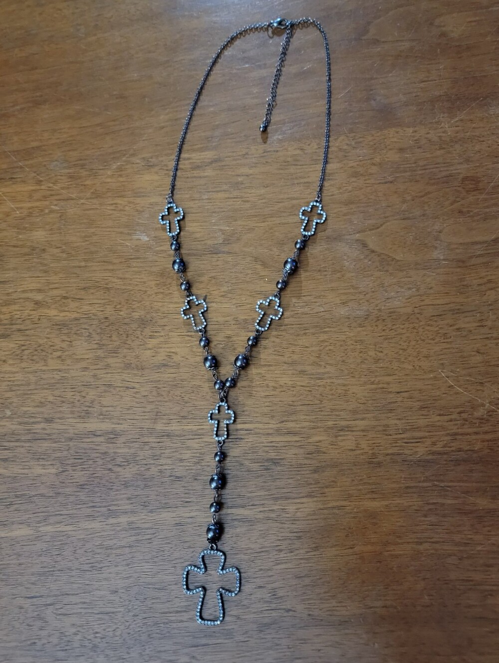 Dark metal and rhinestone cross long necklace